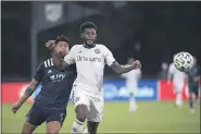  ?? ASSOCIATED PRESS FILE ?? Mark McKenzie, right, in action against Sporting Kansas City, paced a defense that helped the Union earn a 0-0 tie with the New England Revolution Thursday night.