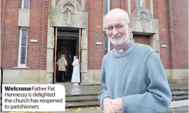  ??  ?? Welcome Father Pat Hennessy is delighted the church has reopened to parishione­rs