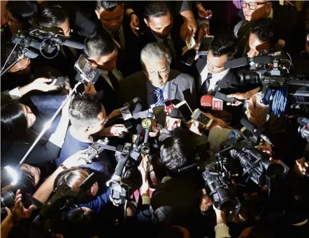  ??  ?? Fielding questions: Dr Mahathir speaking to the media in the Parliament lobby.