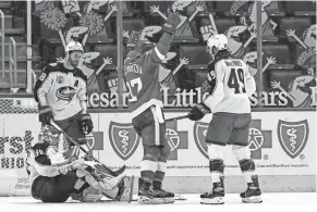  ?? CARLOS OSORIO/AP ?? Red Wings forward Evgeny Svechnikov reacts to the go-ahead goal by Michael Rasmussen in Sunday's 4-1 victory over the Blue Jackets.