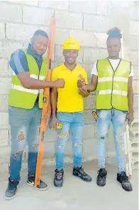  ?? KALLEJHAY TERRELONGE PHOTOS ?? Businessma­n Damion Wright is flanked by Christon Gilroy (left) and Delroy Anderson.