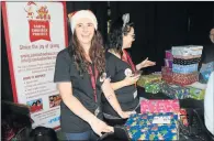  ?? Picture: MICHAEL PINYANA ?? GIVING SPIRIT: Santa Shoebox volunteers Ashton-Leigh Scholtz and Melissa Bessenger collected hundreds of treat-filled, festively wrapped shoeboxes donated by community-minded East Londoners to be distribute­d at 10 under-privileged schools around the...