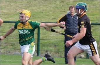  ??  ?? Peter Atkinson of HWH-Bunclody shakes off P.J. Carroll (Adamstown) in the Group B clash in Bellefield.