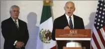  ?? CARLOS BARRIA, THE ASSOCIATED PRESS ?? U.S. Secretary of State Rex Tillerson, left, and Homeland Security chief John Kelly embarked on a “tough trip” to Mexico Thursday.