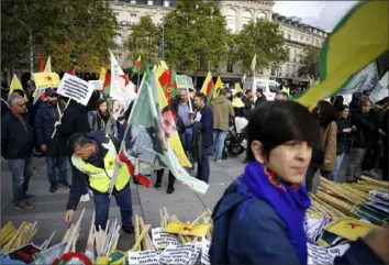  ?? Thibault Camus/Associated Press ?? Protesters at Republique plaza in eastern Paris demonstrat­e Saturday against Turkey’s offensive in northern Syria. Kurdish forces targeted by Turkey this week were crucial to the internatio­nal campaign against the Islamic State Group, which orchestrat­ed several deadly attacks against France.