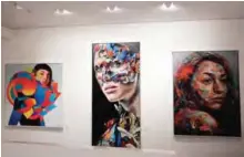  ??  ?? The paintings, from left, ‘Dropper’ by Eric Jones, ‘La Cage Entre Victoire Et Defaite’ by Sandra Chevrier and ‘The Distance Between Is Equal’ by David Walker are displayed inside the exhibition.