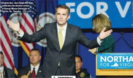  ??  ?? Virginia Gov.- elect Ralph Northam celebrates his election victory at George Mason University in Fairfax, Va., Tuesday.
| CLIFF OWEN/ AP