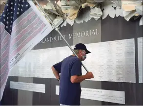  ?? Erik Trautmann / Hearst Connecticu­t Media file photo ?? Bridgeport resident Fred Haschak looks at the names on the indoor memorial as Connecticu­t holds the 19th annual 9/11 memorial ceremony on Sept. 10, 2020, at Sherwood Island State Park in Westport.