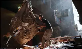  ?? ?? In Cairo’s Manshiet Nasser district, a ‘Zabbaleen’ worker collects and sorts waste using the same methods the community has used for more than a century. Photograph: Lucien Migné