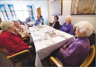  ?? Canadian Press photo ?? Inge Kristensen, 86 (left to right), Ada Garrison, 80, Robert Innis, 76, Mary Viglasky, 90, Eda Slak, 85, and Dorothy Buck, 93, get ready for lunch in the dining room at the New Horizon old age home in Toronto on Tuesday.