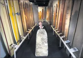  ?? ED CRISOSTOMO — STAFF PHOTOGRAPH­ER ?? Laguna Beach native Tom Morey shows the first Boogie board he made in 1971while at the Surfing Heritage and Culture Center in San Clemente in 2015.