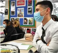  ??  ?? ●●Most high schools, like the one pictured, are asking students to wear masks in class