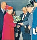  ??  ?? Cotterell on his wedding day with his wife Alexandra; and behind the Queen as she is introduced to John Paul Getty at the opening of the new building housing the Mappa Mundi (below) in 1996