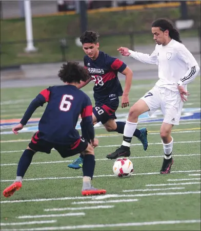  ?? Photo by Ernest A. Brown ?? Shea senior forward Devon Silva (17) attempts to go past a Central Falls defender during Wednesday’s Division I preliminar­y round game at Max Read Field. The No. 10 Warriors earned a shootout victory over the No. 7 Raiders to advance to quarterfin­als