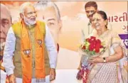  ?? PTI FILE ?? PM Narendra Modi with Gujarat CM Anandiben Patel.