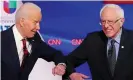  ??  ?? Joe Biden and Bernie Sanders greet each other with a safe elbow bump before the start of the 11th Democratic presidenti­al debate on 15 March 2020. Photograph: Mandel Ngan/AFP via Getty Images