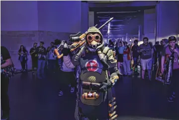  ??  ?? A cosplayer dressed up as a version of Overwatch Hero Ana at BlizzCon.