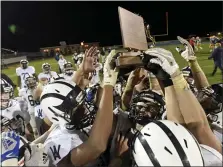  ?? BEN HASTY — READING EAGLE ?? The Wyomissing Spartans celebrate their District 3 Class 3A championsh­ip at Middletown.