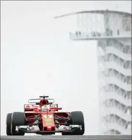  ?? JAY JANNER / AMERICAN-STATESMAN ?? Ferrari’s Sebastian Vettel drives in practice Friday. He has four victories and Mercedes’ Lewis Hamilton has eight this season out of 16 races.