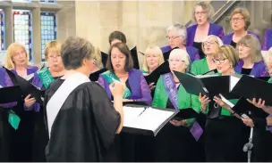  ??  ?? ●●Ladies’ choir, Cantare, performed The Pankhurst Anthem, commission­ed by BBC Radio 3 to mark the centenary.