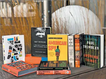  ?? JENNIFER DAY/CHICAGO TRIBUNE ?? The Chicago Tribune’s best books of 2019 include “The Yellow House” by Sarah M. Broom, “Good Talk” by Mira Jacob, “Ducks, Newburypor­t” by Lucy Ellmann, “Say Nothing” by Patrick Radden Keefe, “American Spy” by Lauren Wilkinson, “Go Ahead in the Rain” by Hanif Abdurraqib, “The Memory Police” by Yoko Ogawa, “How to Hide an Empire” by Daniel Immerwahr, “Lost Children Archive” by Valeria Luiselli and “Growing Things” by Paul Tremblay.