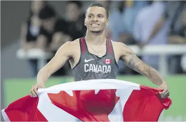  ?? FRANK GUNN / THE CANADIAN PRESS ?? Canadian sprinter Andre De Grasse celebrates his silver medal performanc­e in the men’s 200-metres at the Rio Olympics last week.