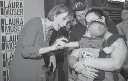  ?? Mark Mulligan / Houston Chronicle ?? Laura Moser greets supporters at a primary campaign party Tuesday at The West End on Westheimer.