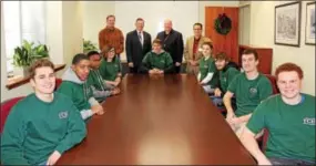  ??  ?? On Dec. 8, students from the Coatesvill­e Area School District and Bishop Shanahan High School in the TCHS Brandywine carpentry program helped to install the new executive conference table at the CCIU. Around the table are Dario Raysor (Bishop...