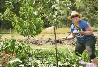  ??  ?? BELOW: Anna says her flourishin­g permacultu­re garden is her happy place.