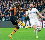  ??  ?? DOUBLE TROUBLE: Oumar Niasse (left) fires his second goal to clinch three points for Hull