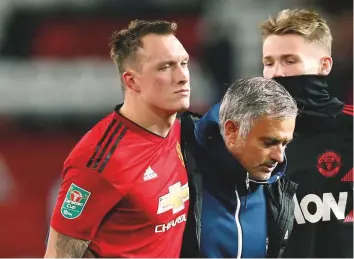  ?? Reuters ?? Manchester United’s Phil Jones and manager Jose Mourinho look dejected after Frank Lampard’s Derby County won the League Cup clash on penalties.