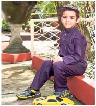  ??  ?? Purple Fish Baju Melayu, Justice League shoes.