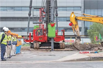  ??  ?? Bulldozers start digging for a renovation project on the eastern side of the Hongqiao airport. A new round of renovation­s was launched at the Hongqiao airport yesterday. — Ti Gong