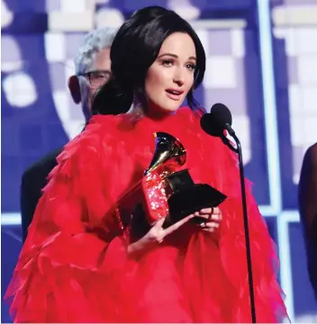  ?? MATT SAYLES/THE ASSOCIATED PRESS ?? It was Kacey Musgraves’ show as she accepted the award for album of the year for Golden Hour. The country singer won four Grammys Sunday in what was her night to remember.