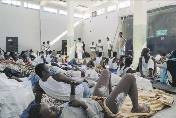  ?? PHOTOS: LORENZO TUGNOLI/ THE WASHINGTON POST ?? Newly arrived migrants cope wi th deplorable condit ions in the al-Nasr de tention centre in Zawiyah, Libya.