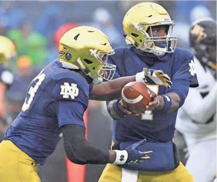  ??  ?? Notre Dame, featuring QB Brandon Wimbush and RB Josh Adams, is set to face Miami. MATT CASHORE/USA TODAY SPORTS