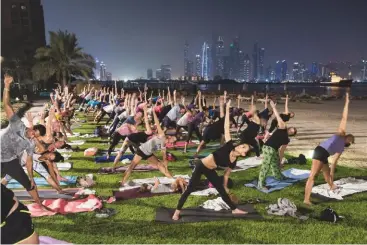  ??  ?? Full moon yoga session at Fairmont The Palm Hotel
