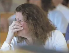  ?? POOL PHOTO ?? HEARTBREAK­ING: Carolyn McGonagle, above, a family friend of Conrad Roy III, tries to hold back her emotions during the trial of Michelle Carter, left.