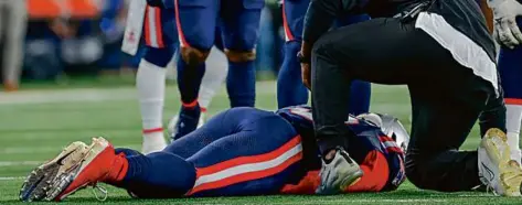  ?? MATTHEW J. LEE/GLOBE STAFF ?? Patriots linebacker Matthew Judon went down in the fourth quarter with a lower biceps tendon tear.