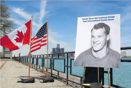  ?? DAVE CHIDLEY/THE CANADIAN PRESS FILES ?? A photo of hockey great Gordie Howe was unveiled during the announceme­nt in May 2015 that a new bridge will be named the Gordie Howe Internatio­nal Bridge in Windsor, Ont. Bridging North America is expected to start major constructi­on in the fall.