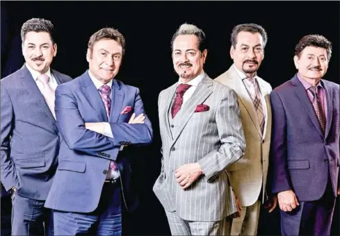  ?? OMAR TORRES/AFP ?? (From left to right) Luis Hernandez, Jorge Hernandez, Hernan Hernandez, Eduardo Hernandez and Oscar Lara, members of the norteno regional Mexican music group Los Tigres del Norte, pose for pictures after an interview with AFP in Mexico City.