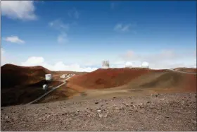  ?? CALEB JONES — THE ASSOCIATED PRESS FILE ?? In this file photo, observator­ies and telescopes sit atop Mauna Kea, Hawaii’s tallest mountain and the proposed constructi­on site for a new $1.4 billion telescope, near Hilo, Hawaii.