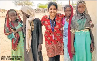  ??  ?? Devaki Erande (center)with a group of Sudanese refugees