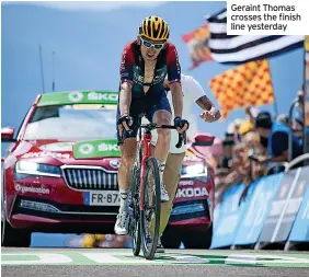  ?? ?? Geraint Thomas crosses the finish line yesterday