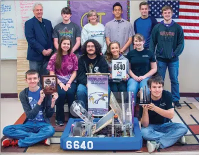  ?? WILLIAM HARVEY/RIVER VALLEY & OZARK EDITION ?? Members of the Mayflower robotics team, Metal Eagles 6640, pose with their robot and the Rookie All-Star Award they received at the Arkansas Rock City Regional competitio­n earlier this month in Little Rock. Standing, from left, are Mayflower...