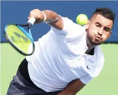  ??  ?? Kyrgios plays a shot against Stan Wawrinka of Switzerlan­d in the Rogers Cup tennis tournament at Aviva Centre in this Aug 7 file photo. — USA TODAY Sports photo