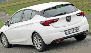  ??  ?? TWEAKS Our spies caught the updated Astra being tested in Germany ahead of its arrival in showrooms next year. Light disguise at the front indicates design changes won’t be major SPYSHOTS