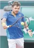  ??  ?? Stanislas Wawrinka returns the ball to Jozef Kovalik during their tennis match at the Roland Garros French Open in Paris. — AFP photo