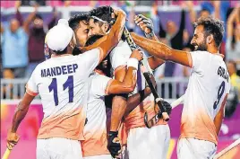  ?? AFP ?? Rupinder Pal Singh (centre) celebrates after scoring against England. India won 43.