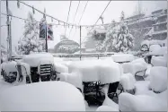  ?? AP PHOTO BY DUNCAN KINCHELOE ?? This Friday, Feb. 15, photo released by Heavenly Mountain Resort shows snow covering chairs and ski equipment at Heavenly Mountain Resort near South Lake Tahoe, Calif.